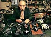 Henri Baigent with model cars in his workshop (Ray Baigent)