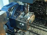 Machining top of engine lugs using a special fixture mounted on the rotary table