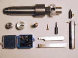 Tooling: note shop-made port cutter in the center of the photo.